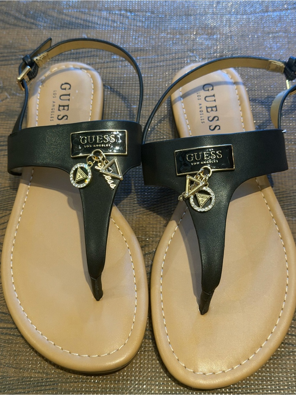 GUESS Black and Beige T-Strap Logo Charm Sandals